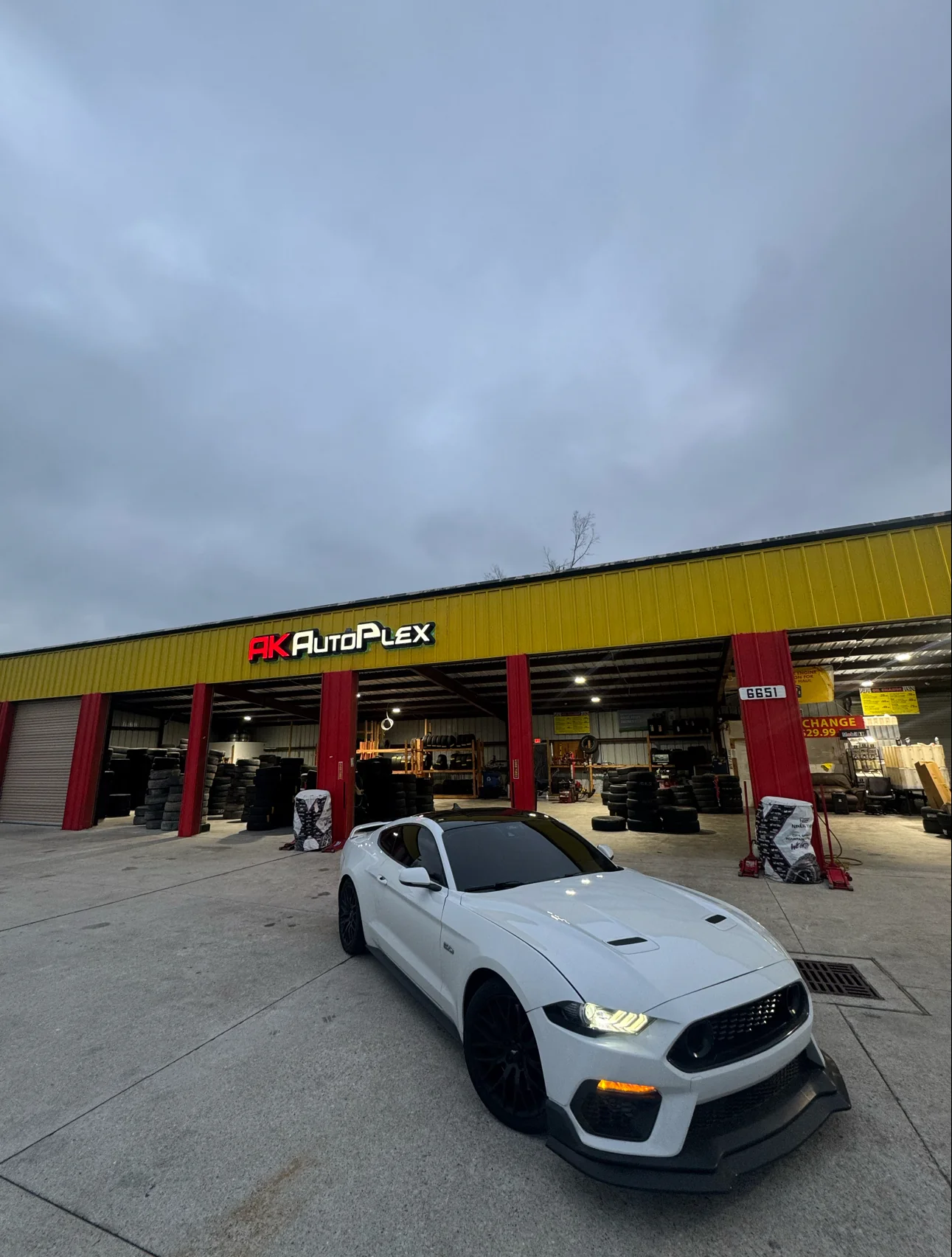 Inside AK AUTOPLEX - TIRES • OIL CHANGE • AUTO CARE — service bay and work area